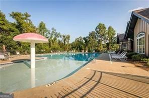 community pool with a patio area