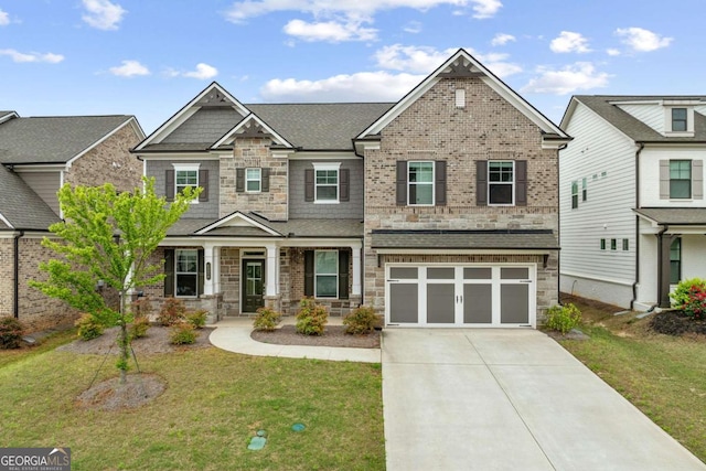 4229 Brookmont Way, Auburn, GA 30011 - craftsman-style house featuring stone siding, driveway, a front lawn, a garage, and covered porch