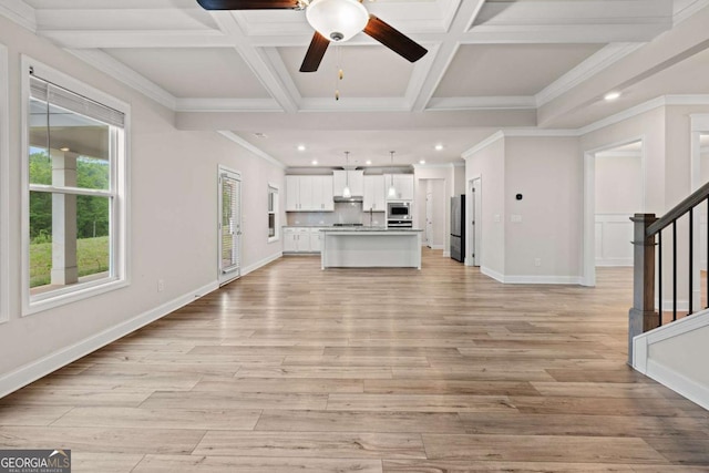 unfurnished living room with a ceiling fan, recessed lighting, baseboards, light wood-style floors, and stairway