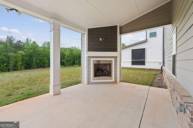 view of patio featuring exterior fireplace