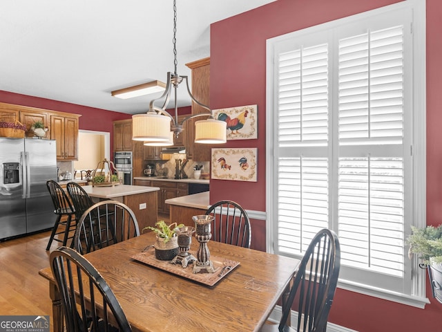 dining area featuring wood finished floors