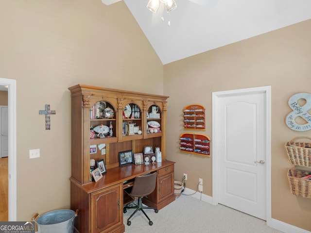 office space with high vaulted ceiling, light carpet, baseboards, and a ceiling fan