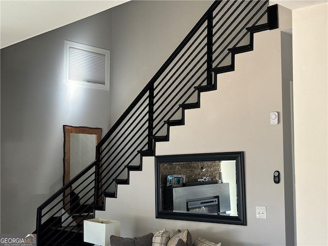 3000 Keeneland Blvd, Mcdonough, GA 30252 - staircase featuring a high ceiling