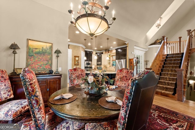 533 Birch River Dr Unit 17, Dahlonega, GA 30533 - dining room with a chandelier, stairs, wood finished floors, and high vaulted ceiling