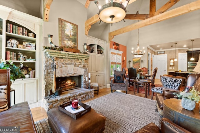 533 Birch River Dr Unit 17, Dahlonega, GA 30533 - living area with high vaulted ceiling, a fireplace, a chandelier, built in features, and wood finished floors