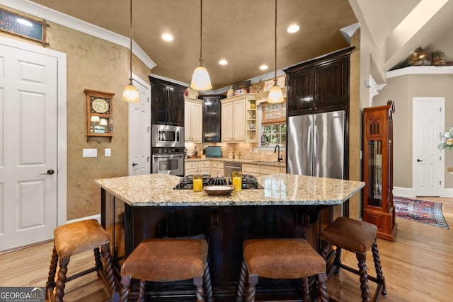 533 Birch River Dr Unit 17, Dahlonega, GA 30533 - kitchen with stainless steel appliances, open shelves, a sink, light wood-style flooring, and a kitchen breakfast bar