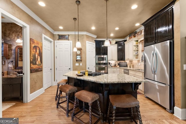 533 Birch River Dr Unit 17, Dahlonega, GA 30533 - kitchen with stainless steel appliances, open shelves, a kitchen island, a breakfast bar, and light wood-style flooring