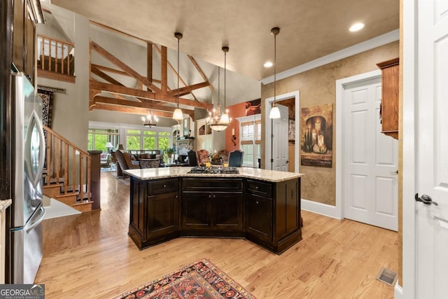 533 Birch River Dr Unit 17, Dahlonega, GA 30533 - kitchen featuring freestanding refrigerator, a chandelier, open floor plan, light wood-type flooring, and light stone counters