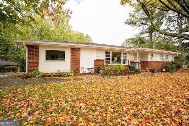view of front of home featuring brick siding