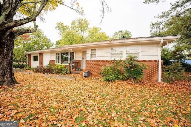 ranch-style home with brick siding