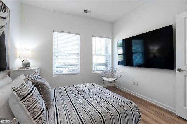 4856 Allatoona Unit 8, Acworth, GA 30101 - bedroom featuring baseboards, visible vents, and wood finished floors