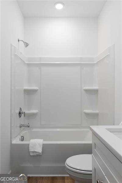 4856 Allatoona Unit 8, Acworth, GA 30101 - full bath featuring toilet, shower / bath combination, vanity, and wood finished floors