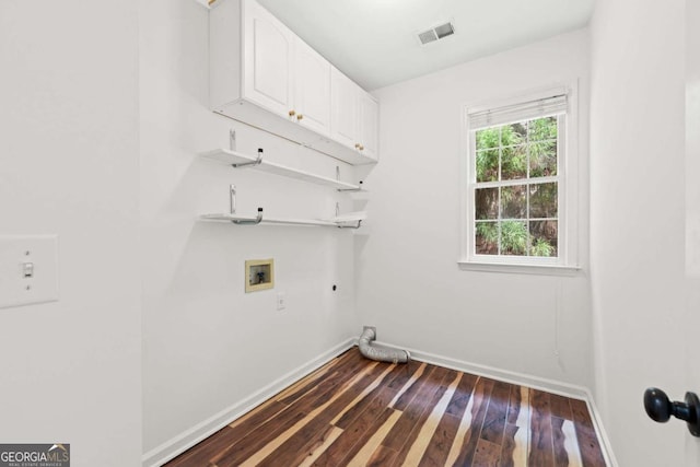 washroom featuring cabinet space, washer hookup, hookup for an electric dryer, visible vents, and baseboards