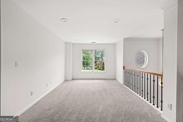 carpeted empty room featuring baseboards, ornamental molding, and recessed lighting