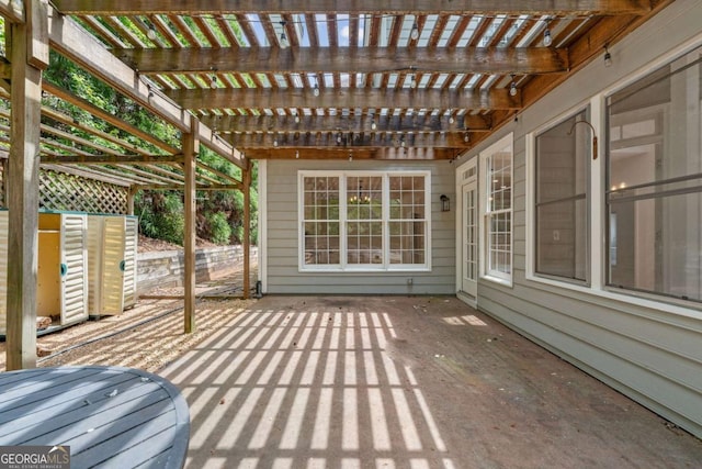 wooden deck with a pergola and a patio area