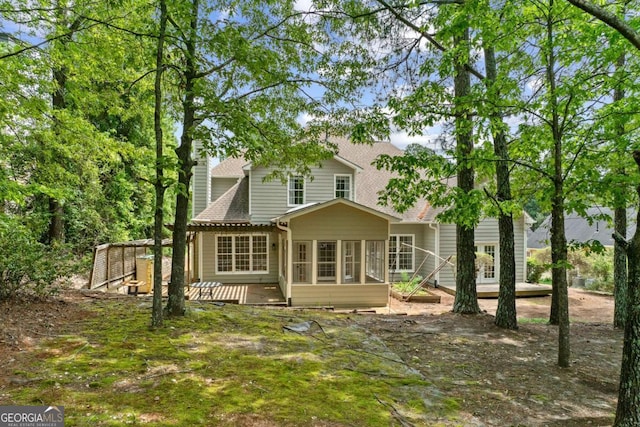 7020 Grand View Way, Suwanee, GA 30024 - back of house with a deck, roof with shingles, and a sunroom