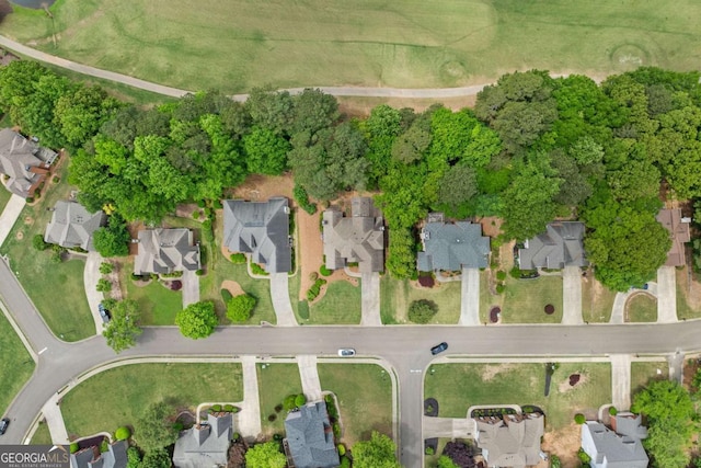 birds eye view of property with a residential view
