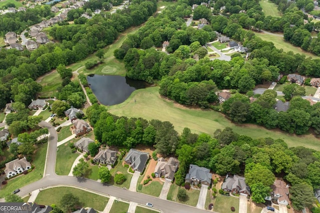 birds eye view of property with a water view, a residential view, and view of golf course