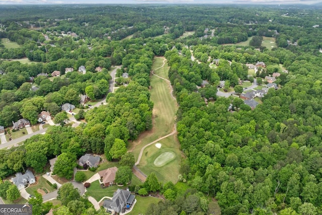 aerial view featuring a wooded view