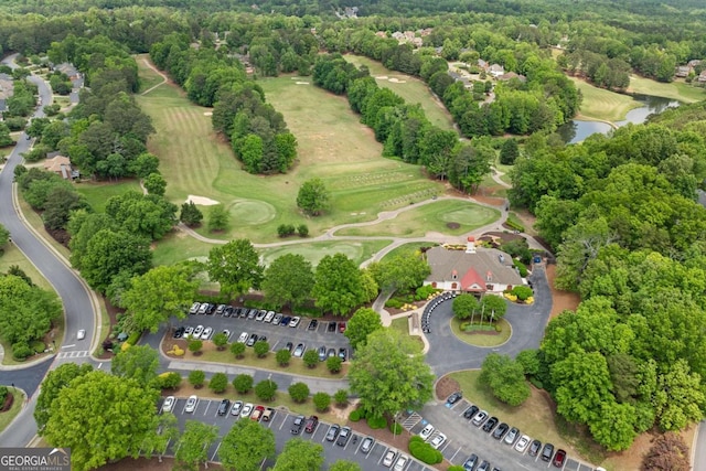 bird's eye view featuring a water view and golf course view