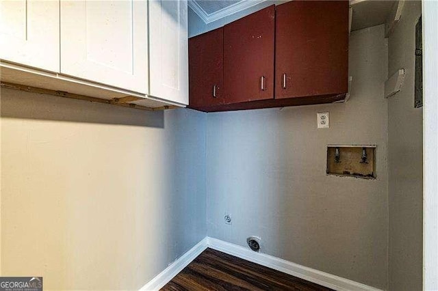 laundry area featuring electric dryer hookup, cabinet space, washer hookup, dark wood-type flooring, and baseboards
