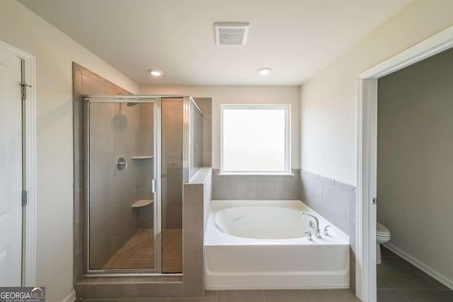 5958 Green Ash Ct, Braselton, GA 30517 - bathroom with a bath, a stall shower, and tile patterned flooring