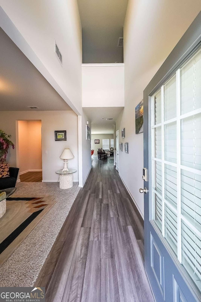 5958 Green Ash Ct, Braselton, GA 30517 - hallway with dark wood-style flooring and a high ceiling