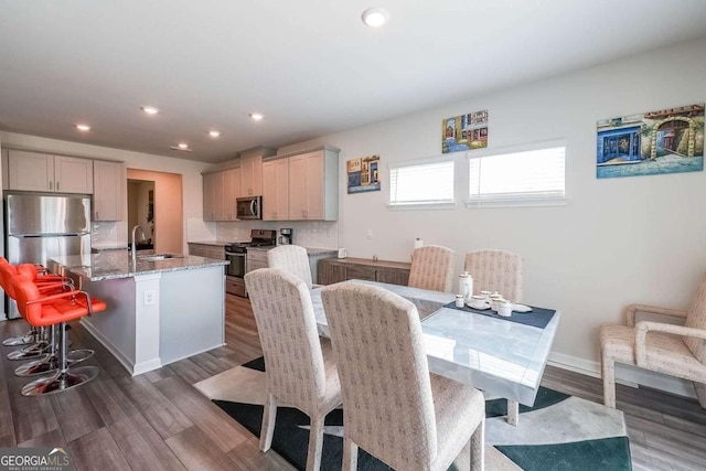 5958 Green Ash Ct, Braselton, GA 30517 - dining area with recessed lighting and dark wood-type flooring