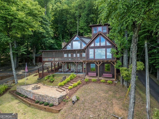 889 Chestnut Rdg, Blue Ridge, GA 30513 - back of house with a fire pit, a wooden deck, stairway, a patio area, and a forest view