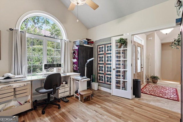 office area featuring high vaulted ceiling, a ceiling fan, and wood finished floors