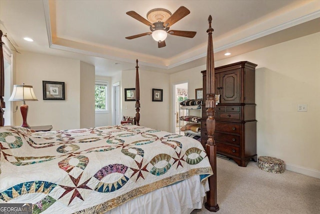 bedroom with a tray ceiling, light carpet, baseboards, and recessed lighting