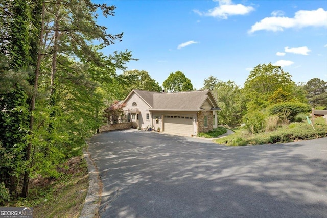 view of front of property with driveway and an attached garage