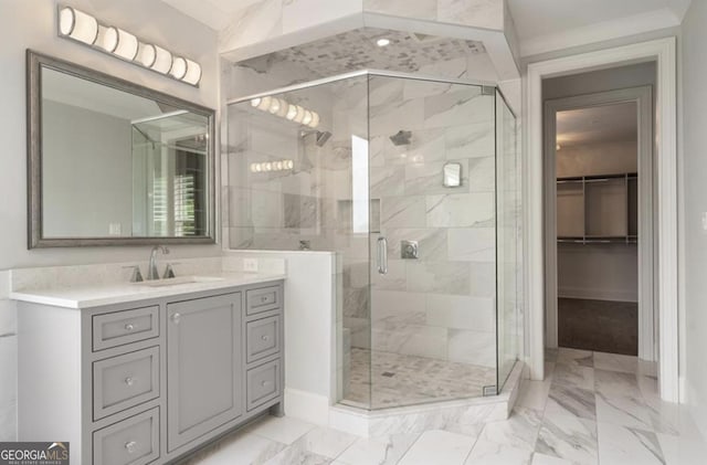 210 Marjean Way, Alpharetta, GA 30009 - bathroom with marble look tiles, baseboards, vanity, and a shower stall