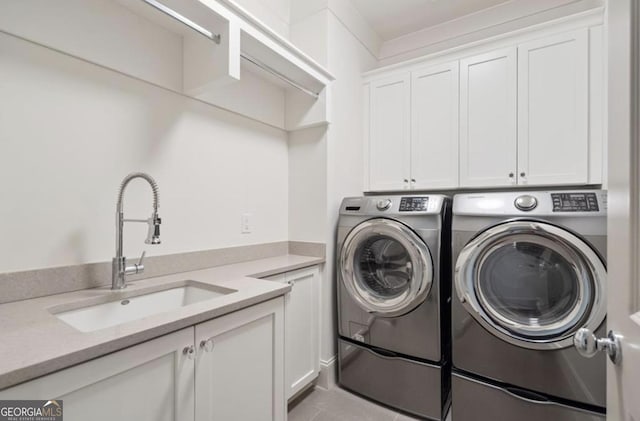 210 Marjean Way, Alpharetta, GA 30009 - clothes washing area featuring cabinet space, washing machine and dryer, and light tile patterned floors