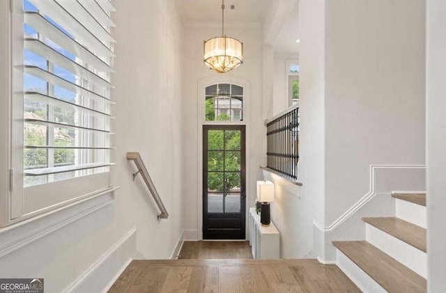 210 Marjean Way, Alpharetta, GA 30009 - foyer featuring a chandelier, wood finished floors, baseboards, stairs, and a high ceiling