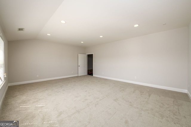 unfurnished room featuring carpet floors, recessed lighting, baseboards, and vaulted ceiling