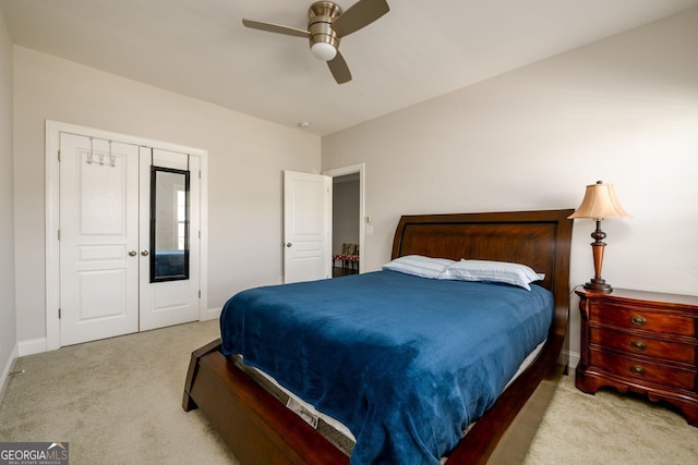bedroom with carpet flooring, baseboards, and ceiling fan