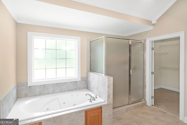 full bath with ornamental molding, a shower stall, tile patterned floors, a tub with jets, and a spacious closet