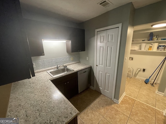 kitchen with dishwasher, light tile patterned floors, visible vents, a sink, and light countertops