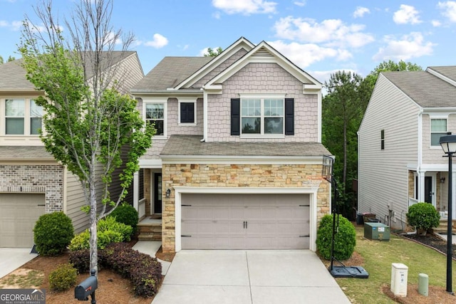 view of front of property with stone siding, driveway, a garage, and central AC