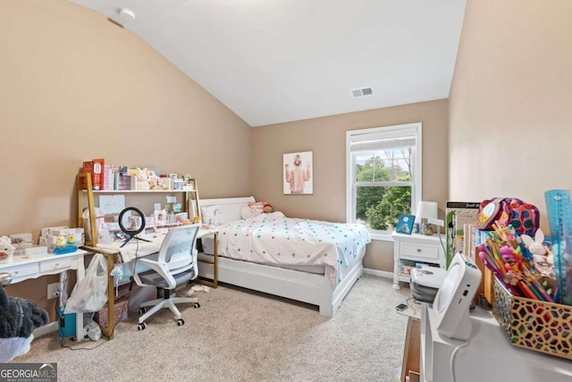 bedroom featuring lofted ceiling, visible vents, and carpet floors