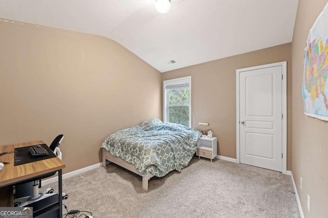 bedroom featuring visible vents, baseboards, lofted ceiling, and carpet floors