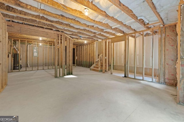 unfinished below grade area with stairs and water heater