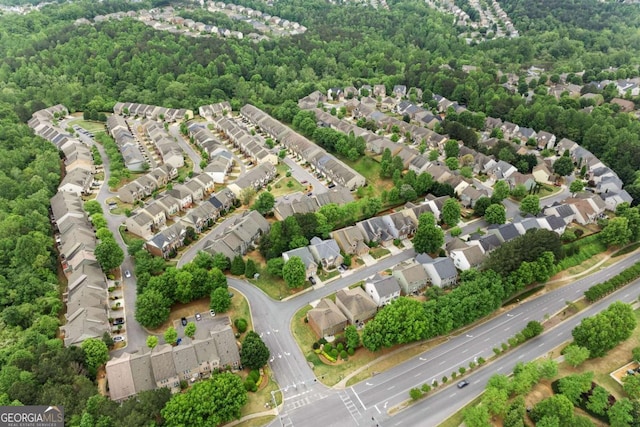 bird's eye view with a forest view and a residential view