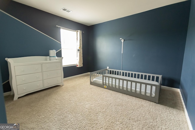 8045 Coleson Xing, Locust Grove, GA 30248 - carpeted bedroom featuring baseboards and a crib