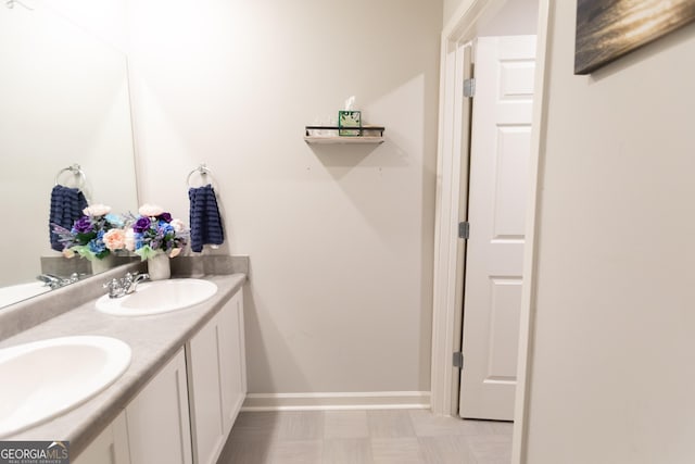 8045 Coleson Xing, Locust Grove, GA 30248 - bathroom with double vanity and baseboards