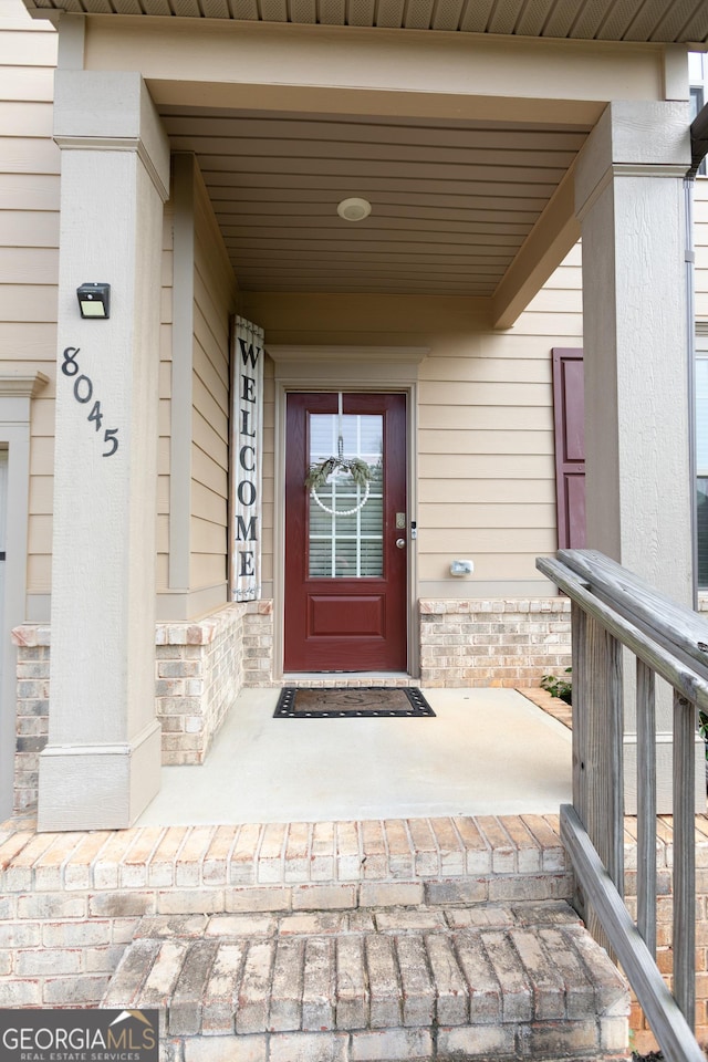 8045 Coleson Xing, Locust Grove, GA 30248 - entrance to property with stone siding and a porch