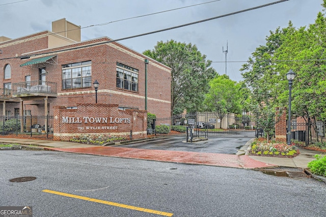 791 Wylie St SE Unit 410, Atlanta, GA 30316 - view of asphalt street with curbs, street lighting, a gate, and sidewalks