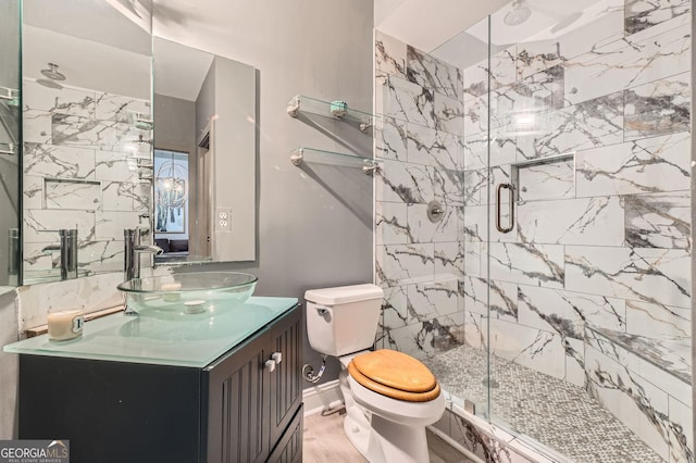 791 Wylie St SE Unit 410, Atlanta, GA 30316 - full bathroom with a shower stall, toilet, vanity, wood finished floors, and baseboards
