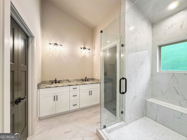 bathroom with a sink, lofted ceiling, a marble finish shower, and marble finish floor